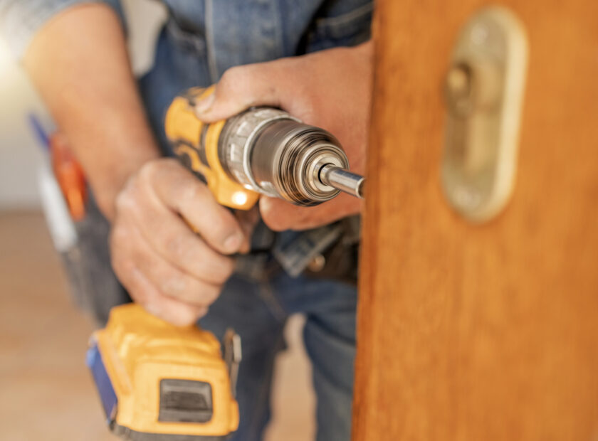 handyman fixing door in rental property